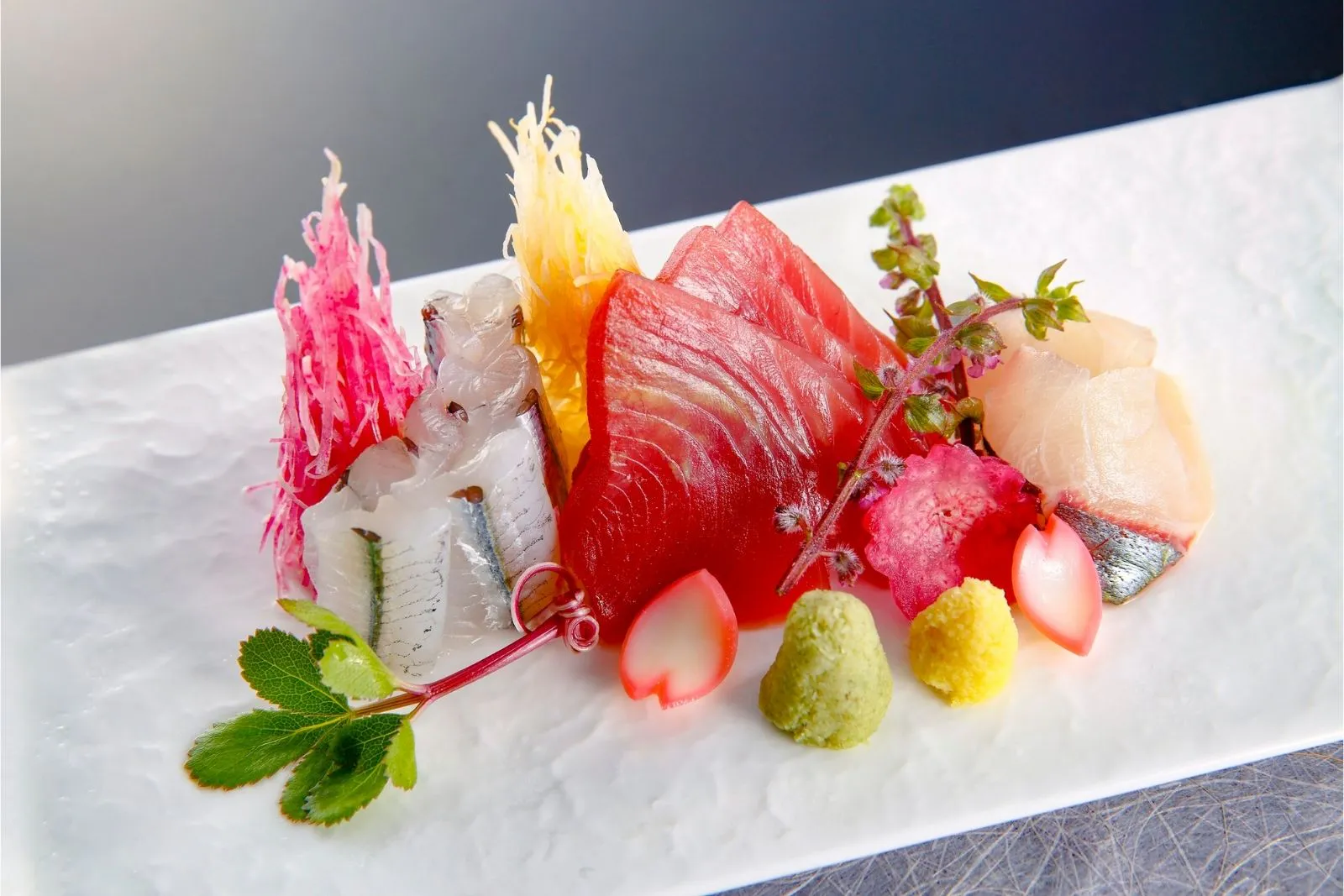 Premium assorted sashimi platter with decorative floral and vegetable garnish at Teppan Salem Enterprise LLC, a Japanese Restaurant in Salem