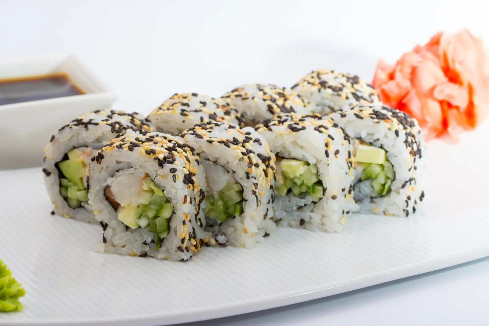 Shrimp avocado maki roll coated with mixed black and white sesame seeds at Teppan Salem Enterprise LLC, a Japanese Restaurant in Salem