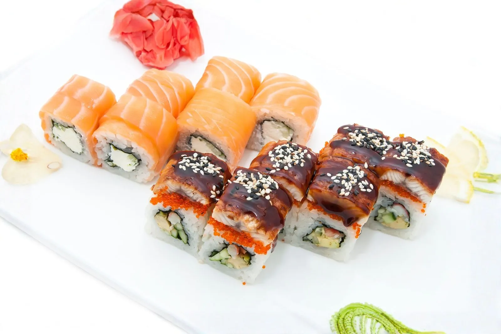 Two varieties of sushi rolls: salmon wrap and glazed eel tobiko maki at Teppan Salem Enterprise LLC, a Japanese Restaurant in Salem